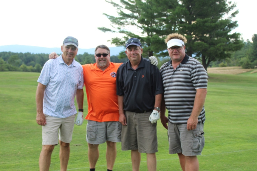 team photo from employee golf tournament