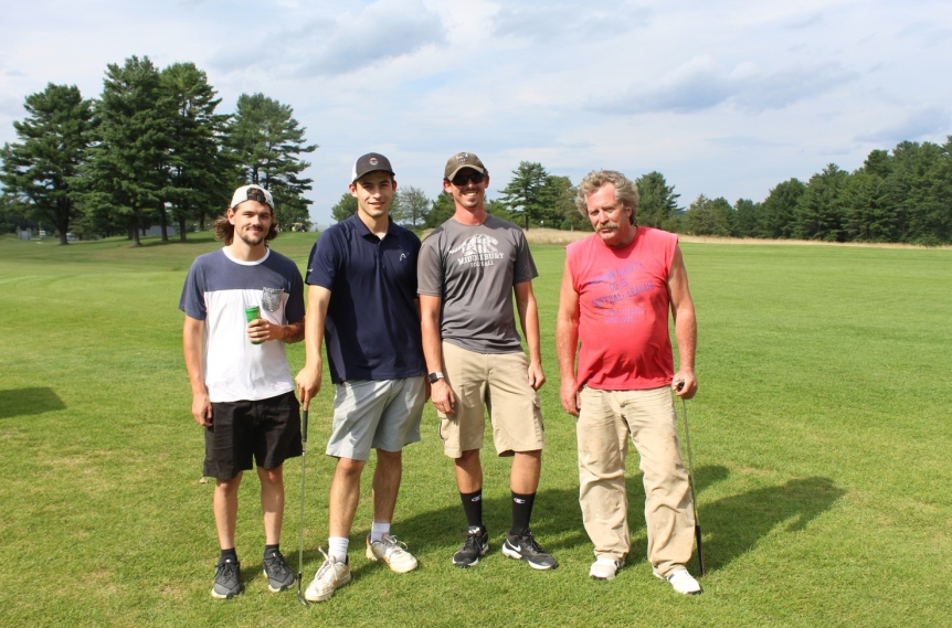 team photo from employee golf tournament