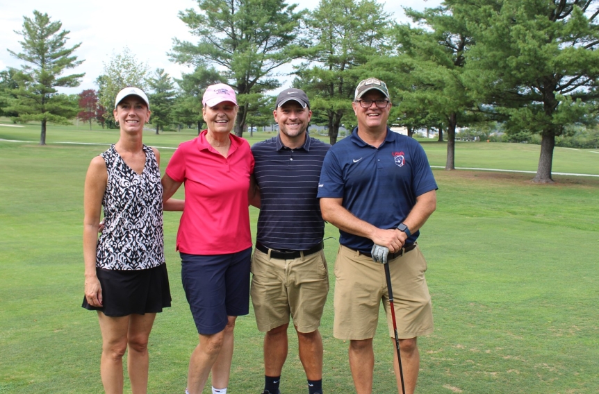 team photo from employee golf tournament