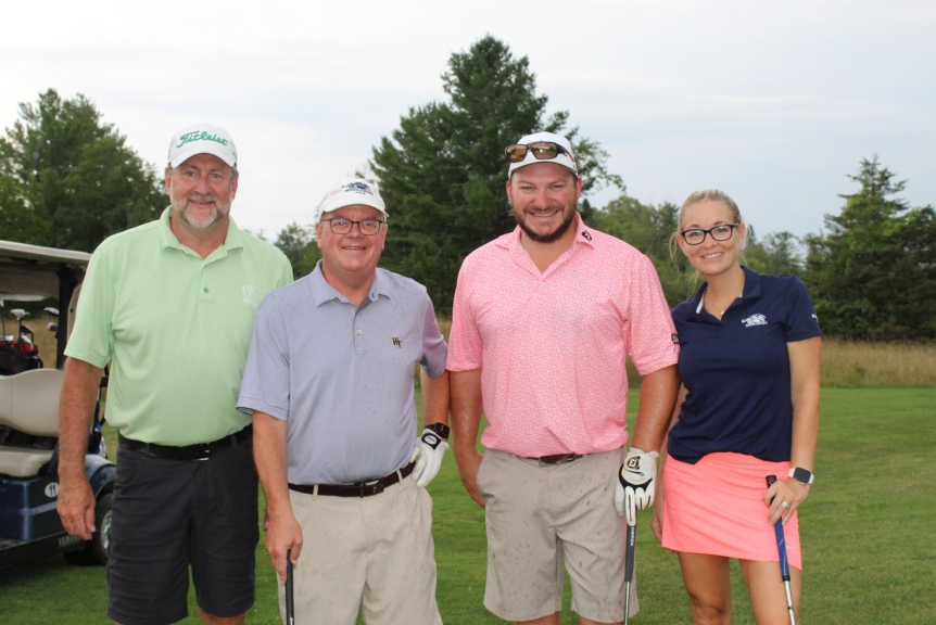 team photo from employee golf tournament