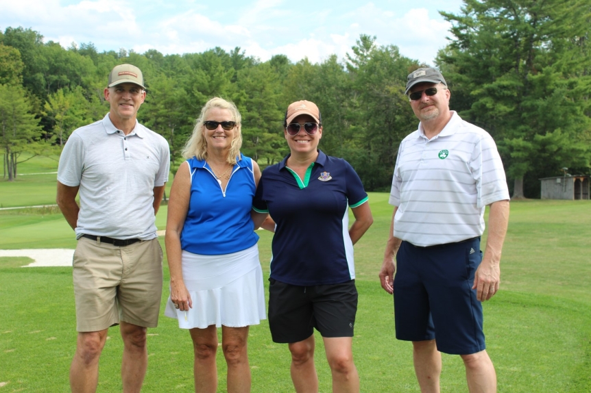 team photo from employee golf tournament