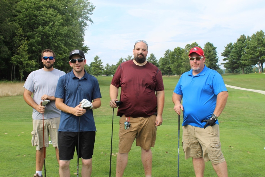 team photo from employee golf tournament