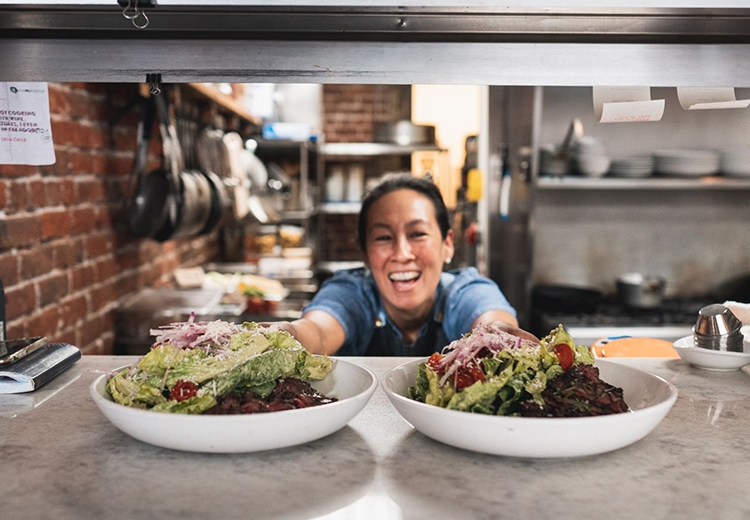 Robynne Maii ’96 Serving Salads