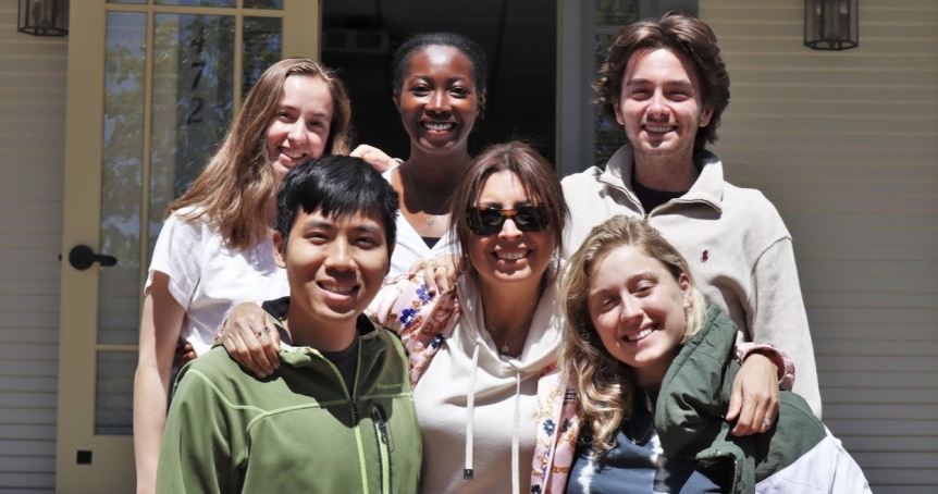 Six students smiling together