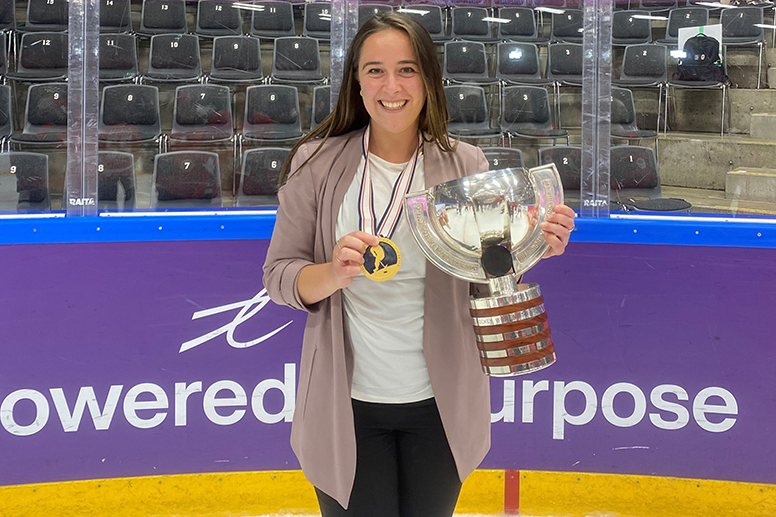 Tania Kenny ’08 holding a trophy