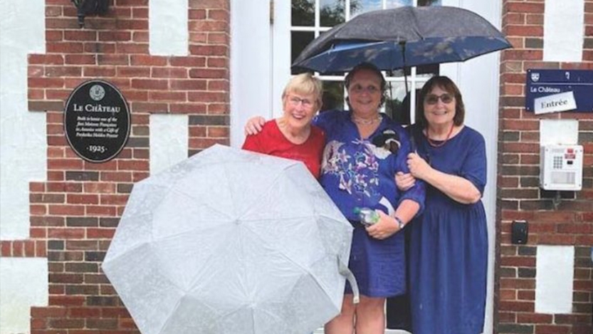 Language Associate Director Barbara Sicot is flanked by two older students — Joan Johnson, left, and Susanne Cox