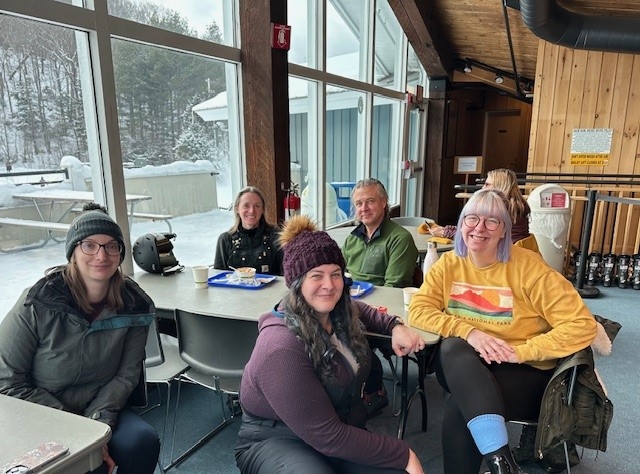 Staff visiting inside the ski lodge
