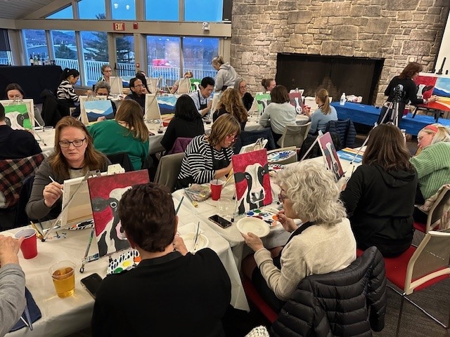Shot of several participants in the process of painting