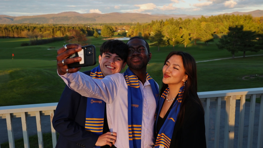 Graduates taking a group selfie
