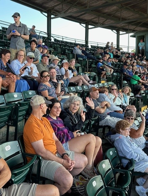 Group of Middlebury Employees sitting in the stands at Centennial Field waiting for the game to start. 