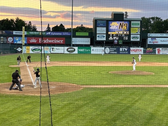 the field with players on the pitcher is about to pitch to a batter on the left side