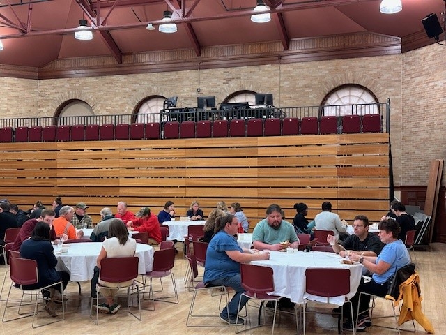 Group of Middlebury Employees sitting and eating