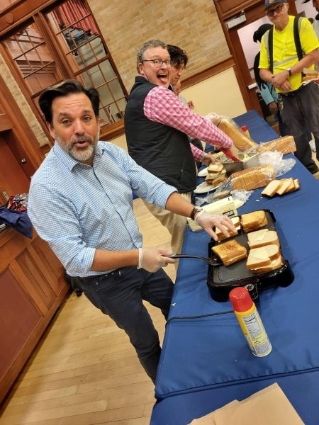 Employees making grilled cheese