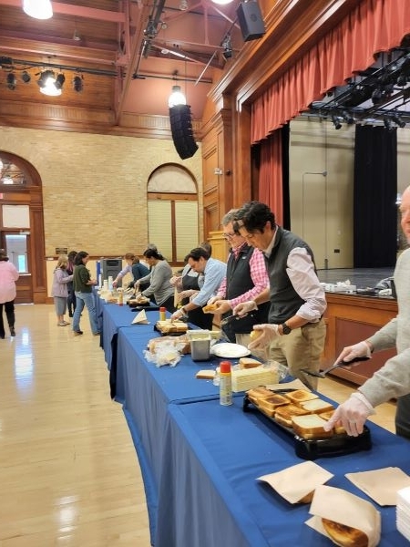 Employees making grilled cheese