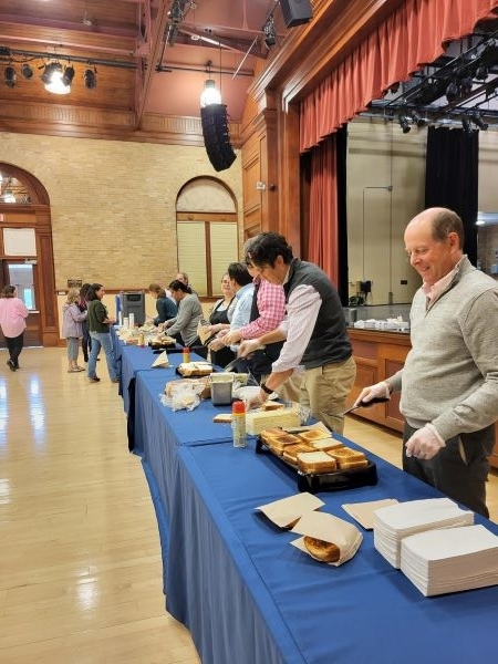 Employees making grilled cheese