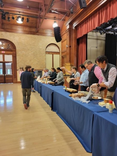 Employees making grilled cheese