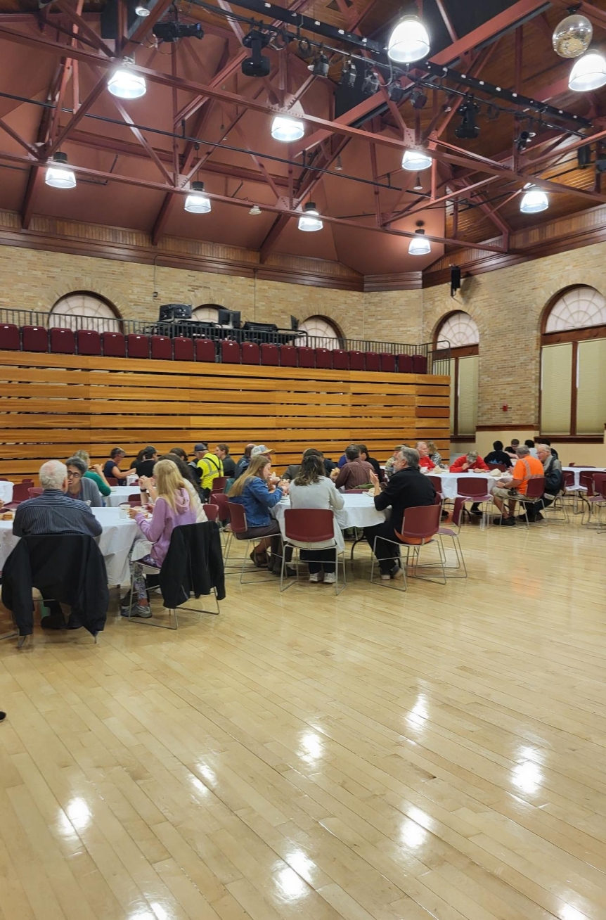 Group of employees eating grilled cheese and tomato soup