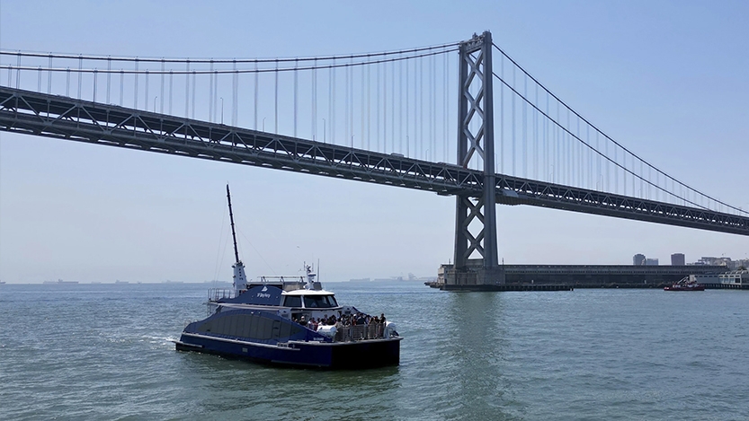 Boat in in the bay below the Golden Gate Bridge