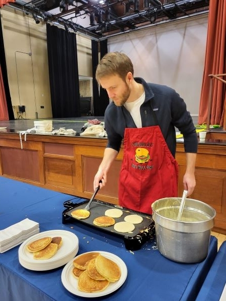 Employee cooking pancakes