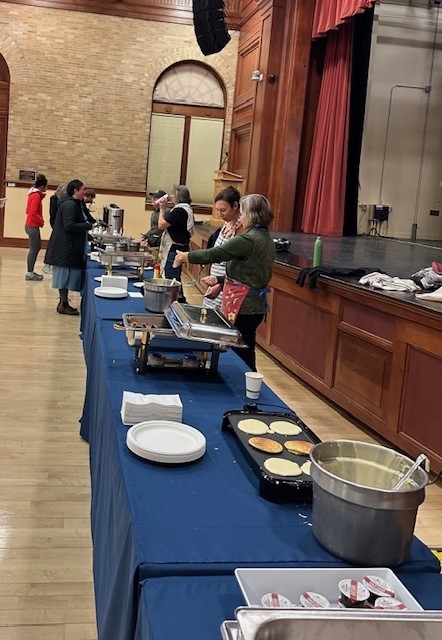 Employees cooking pancakes