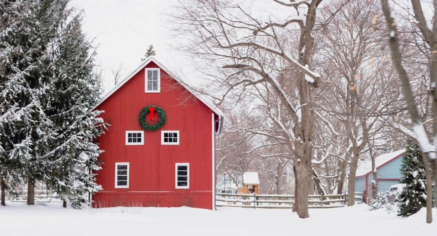 Red barn & wreath with snow-covered trees
