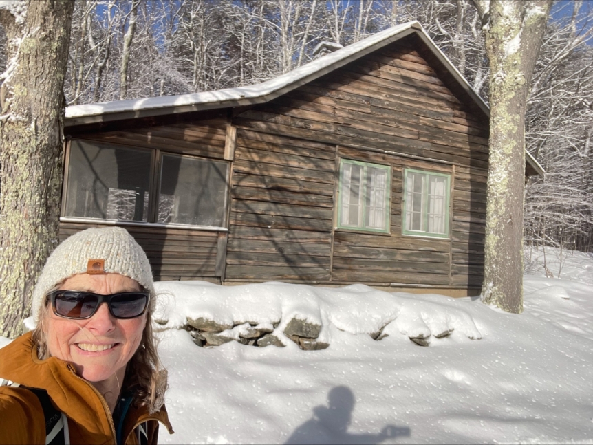 Picture of employees in front of a lodge at Rikert