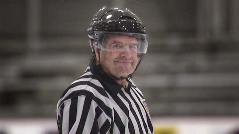 Portrait Vermont State Senator Brian Collamore ’72 on a skating rink in his reffing uniform