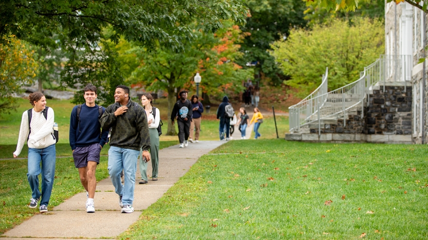 Students walking in front o Munroe Hall