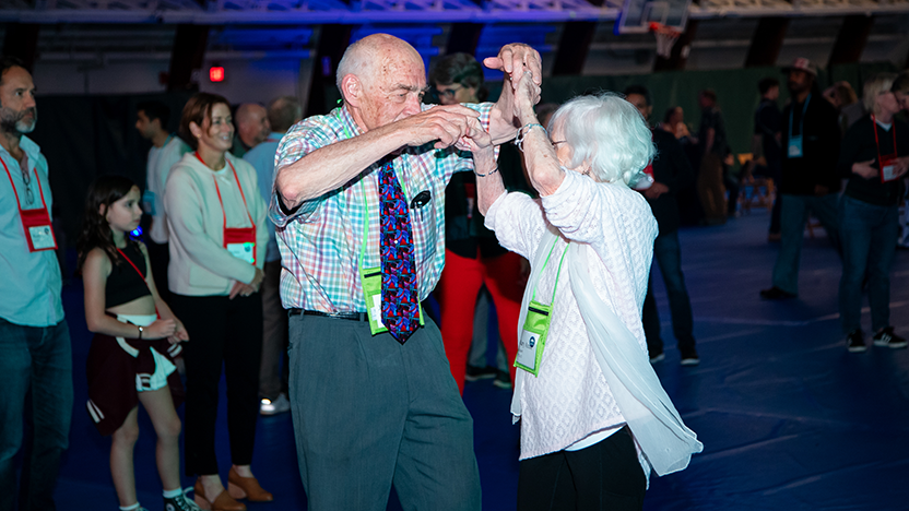 Jim Perry '60 leads Mary Anne Liguori into a turn on the dancefloor in Nelson Arena.