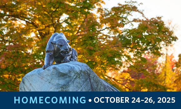 Statue of the Panther on the rock outside Alumni Stadium, surrounded by autumn leaves