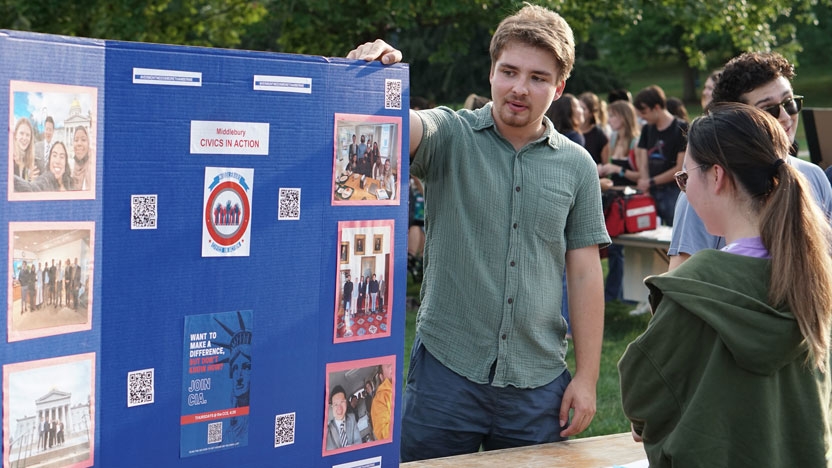 A student talks to others about Civics in Action.