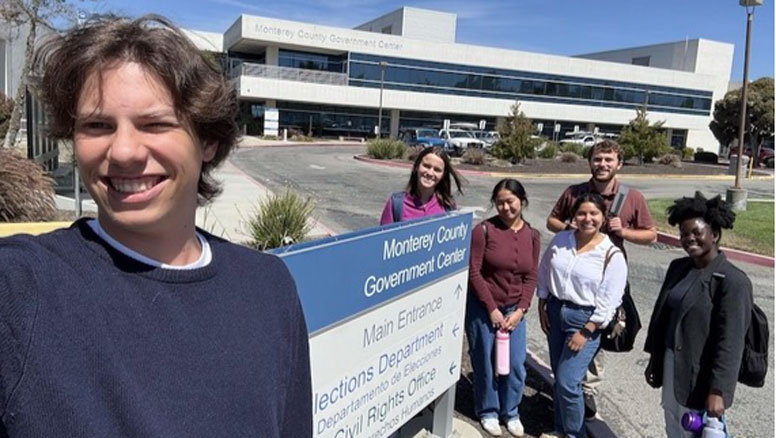 Students pose for a photo outside the Monterey County Government Center.