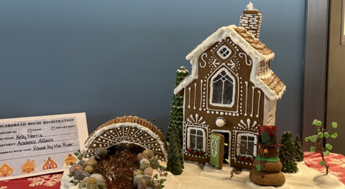 Gingerbread house on wooden circular board