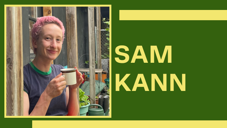 Portrait of Sam Kann ’21 holding a coffee mug while looking at the camera.