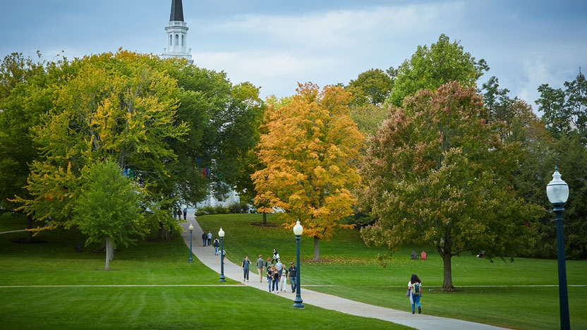 Student walking through campus between classes.
