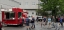 Employees wait in line for a breakfast sandwich