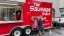 Employees enjoying breakfast sandwiches at the Sausage Shack.