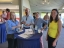 Four colleagues standing at a table
