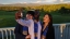 Graduates taking a group selfie