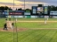 the field with players on the pitcher is about to pitch to a batter on the left side