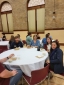 Employees sitting eating grilled cheese