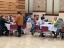 Colleagues sitting together eating breakfast and talking
