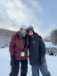 Employees standing together getting ready to get on the ski lift