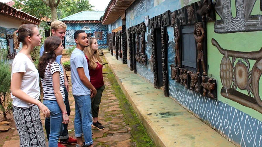 A large yellow building on the Bread Loaf campus.