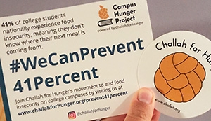 Two Challah For Hunger promotional stickers.