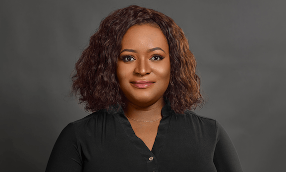 Temie Giwa-Tubosun, wearing a black shirt, with