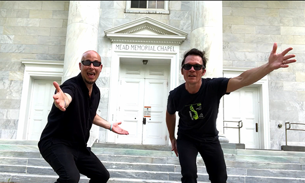 The Grift members Clint Bierman and Peter Day dancing in front of Mead Chapel