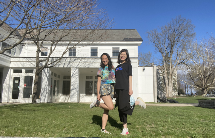 Theresa and Tina standing in the courtyard behind FECH in the sunshine