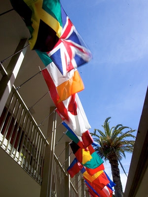 View of the flags and the blue sky on the MIIS campus.