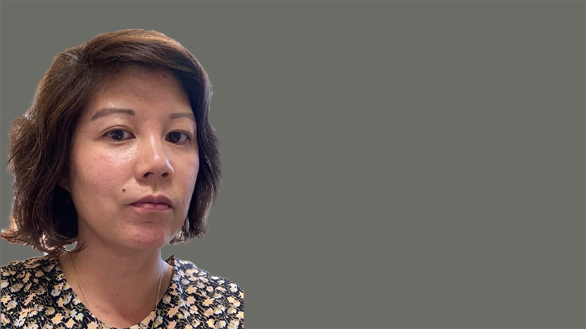 Joyce Mao in floral pattern blouse